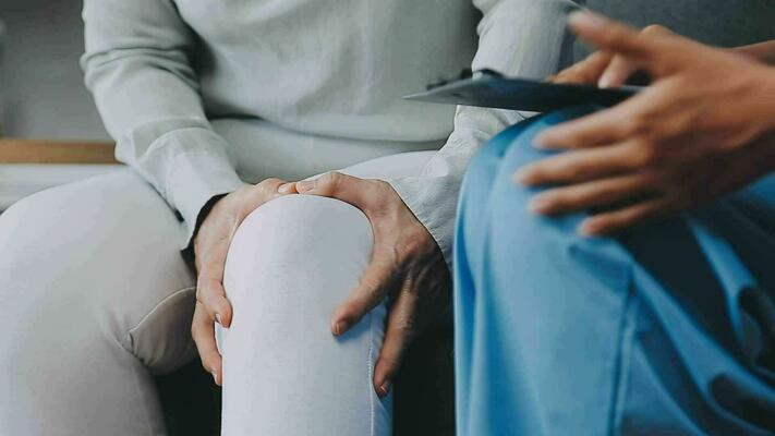 doctor-and-patient-sitting-and-talking-at-medical-examination-at-hospital-office-close-up-therapist-filling-up-medication-history-records-medicine-and-healthcare-concept-free-video